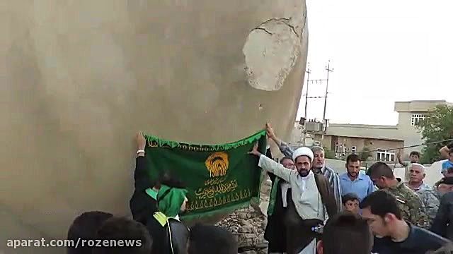 اهتزاز  پرچم امام رضا بر گلدسته مسجد خلافت ابوبکربغدادی